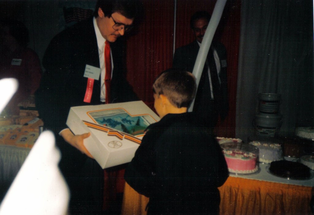 Presenting Rhys with a surprise birthday cake at a Food Show